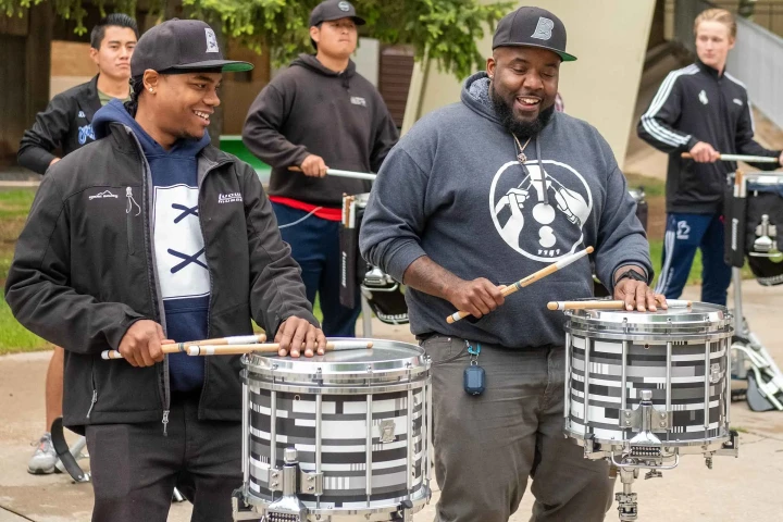 Byos playing snare with The Blue Devils